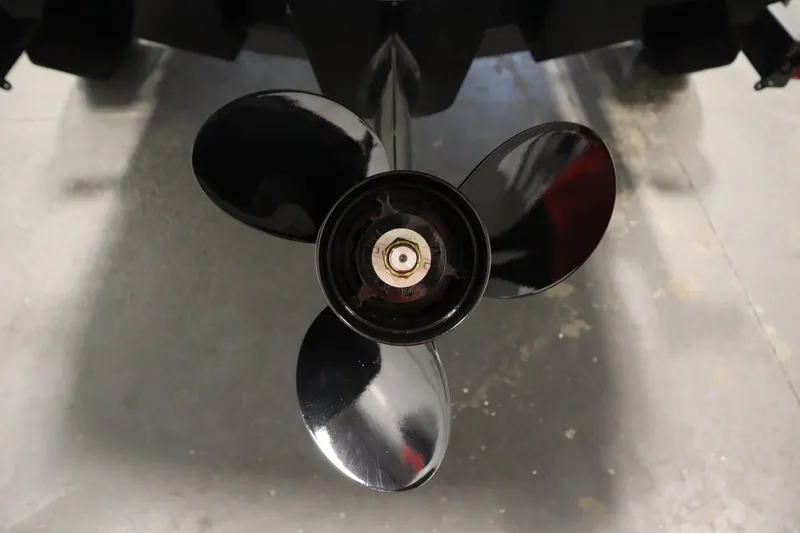 Slide: The Image of 2025 Bayliner VR6 Bowrider OB propeller, close-up view in a garage setting. - 54