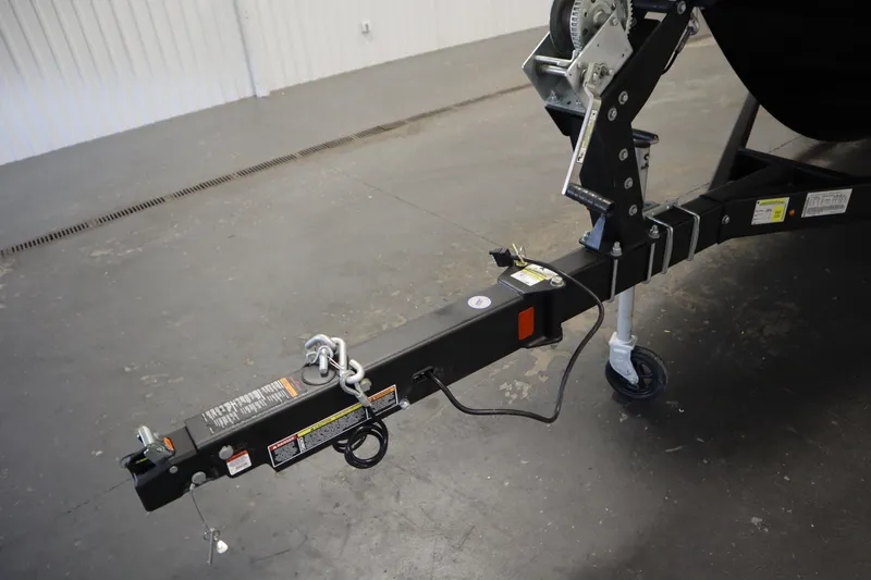 Slide: The Image of Trailer hitch of 2025 Bayliner VR6 Bowrider OB in a garage setting. - 55