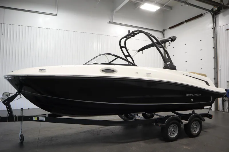 Slide: The Image of 2025 Bayliner VR6 Bowrider OB boat on trailer in indoor showroom. - 7