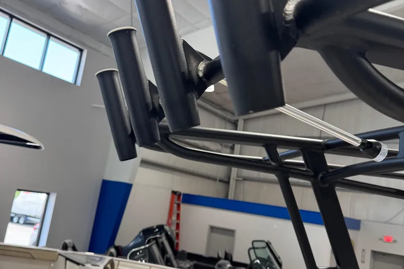 Slide: The Image of 2024 Yamaha Boats 190 FSH Sport rod holders in a showroom setting. - 5