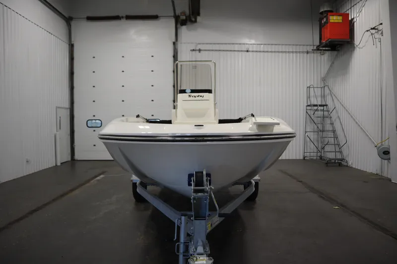 Slide: The Image of 2026 Bayliner Trophy T18 boat on trailer in indoor storage facility. - 1