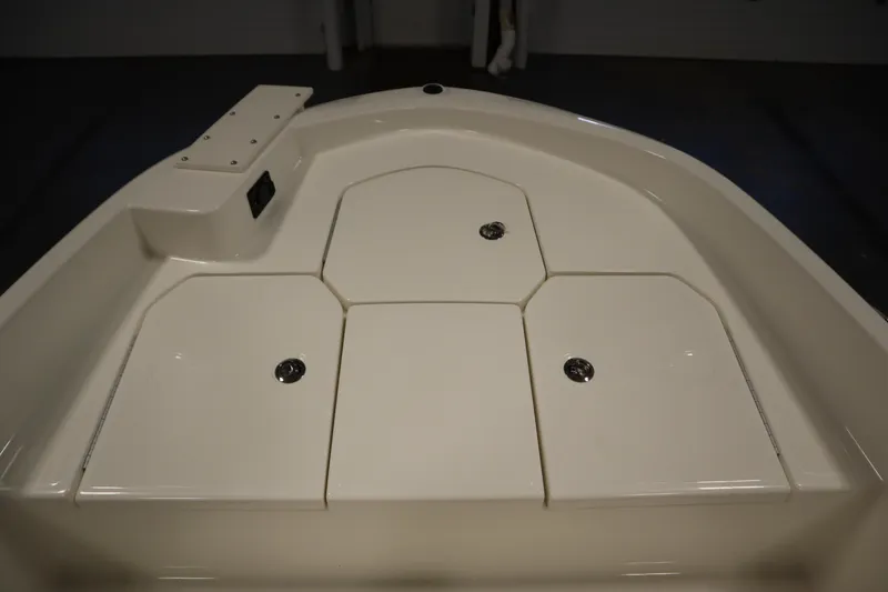 Slide: The Image of 2026 Bayliner Trophy T18 boat deck with storage compartments. - 10