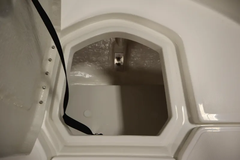 Slide: The Image of Interior storage compartment of 2026 Bayliner Trophy T18 boat, featuring sleek design. - 12