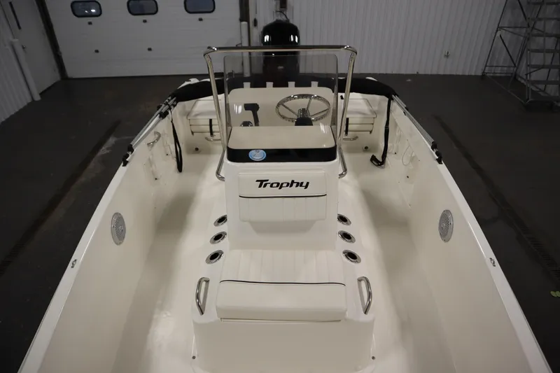 Slide: The Image of 2026 Bayliner Trophy T18 boat interior with steering console and seating. - 15