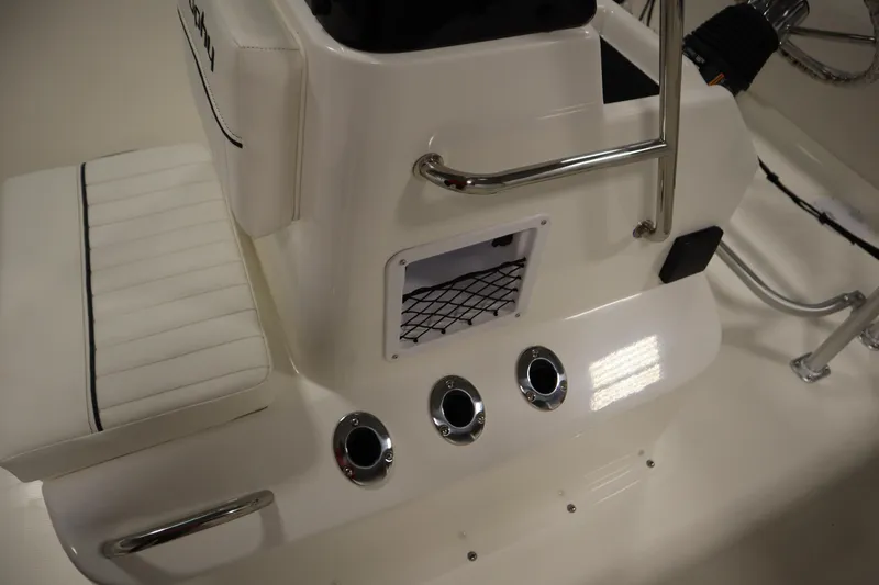 Slide: The Image of 2026 Bayliner Trophy T18 boat interior with white seating and chrome accents. - 17