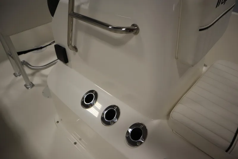 Slide: The Image of 2026 Bayliner Trophy T18 boat interior with rod holders and seating. - 19
