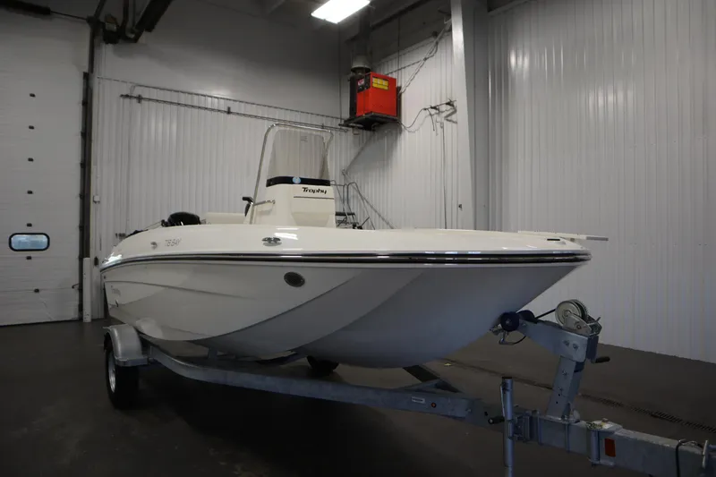 Slide: The Image of 2026 Bayliner T18 LE boat on trailer in indoor storage facility. - 2