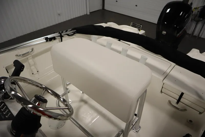 Slide: The Image of Interior view of 2026 Bayliner Trophy T18 boat, featuring steering wheel and seating. - 28