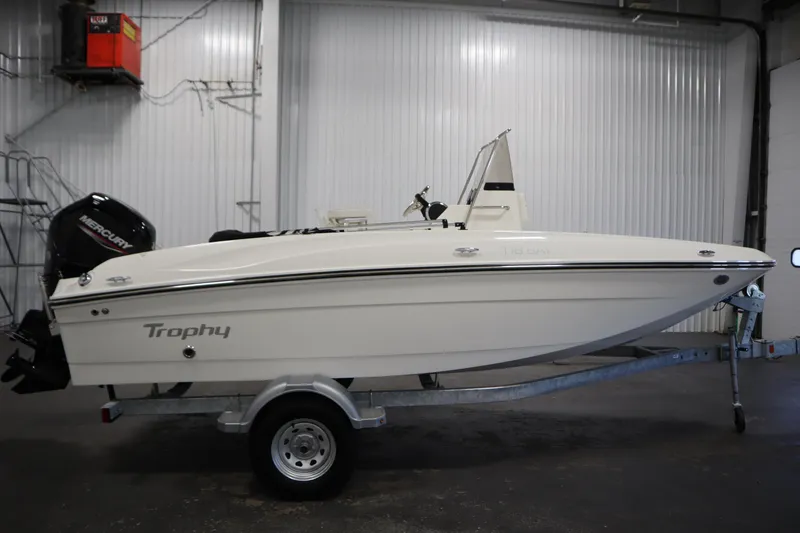 Slide: The Image of 2026 Bayliner Trophy T18 boat on trailer in indoor storage. - 3