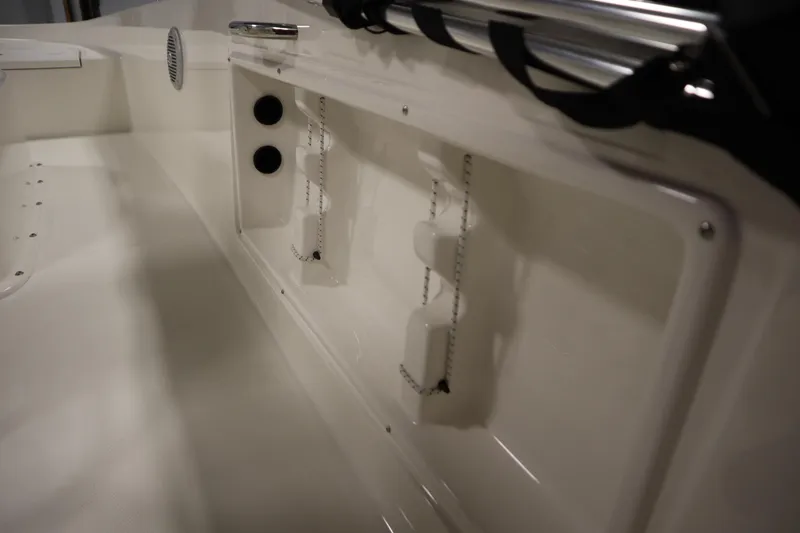 Slide: The Image of 2026 Bayliner Trophy T18 interior detail with storage compartments and sleek design. - 30
