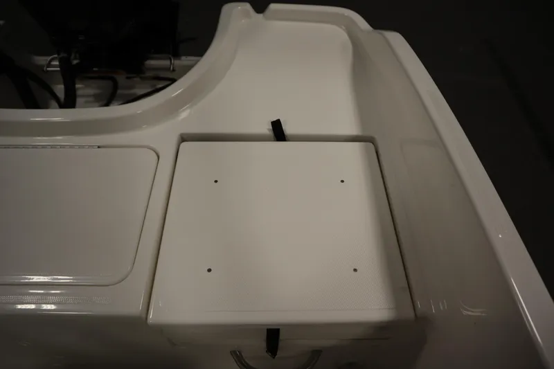 Slide: The Image of Bayliner Trophy T18 2026 boat deck detail with storage compartment. - 32