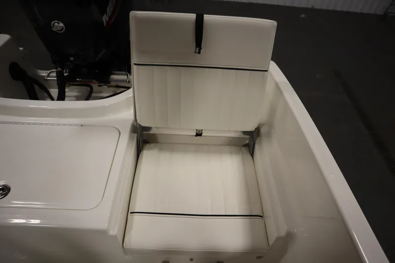 Slide: The Image of 2026 Bayliner Trophy T18 boat seat with white upholstery and black accents. - 33