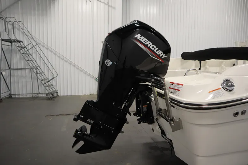 Slide: The Image of 2026 Bayliner Trophy T18 with Mercury outboard motor in a showroom. - 36