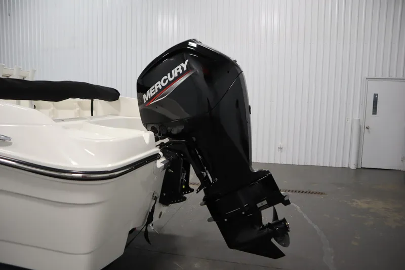Slide: The Image of 2026 Bayliner Trophy T18 with Mercury outboard motor in a showroom. - 37