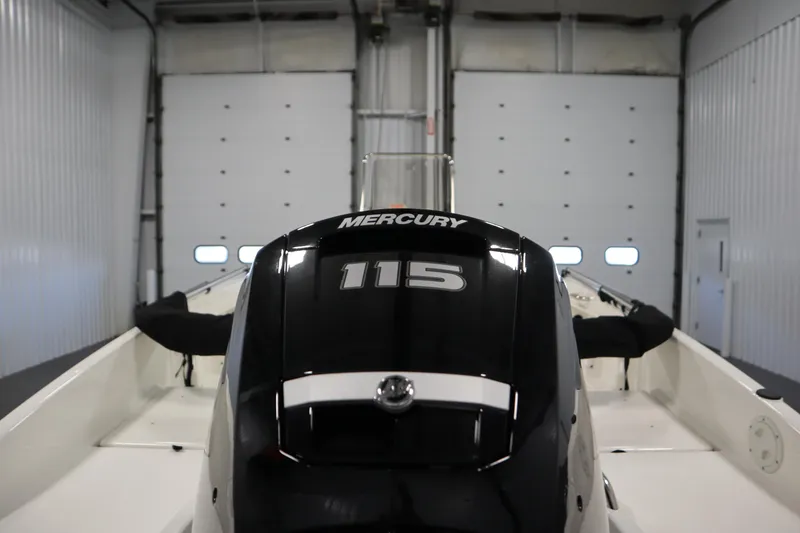 Slide: The Image of 2026 Bayliner Trophy T18 with Mercury 115 engine in a garage setting. - 38