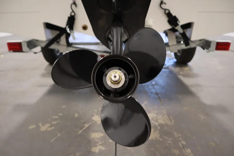 Slide: The Image of 2026 Bayliner Trophy T18 boat propeller and trailer close-up. - 39