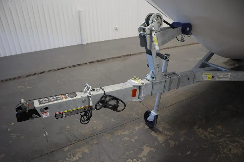 Slide: The Image of Trailer hitch of 2026 Bayliner Trophy T18 boat in a garage setting. - 40