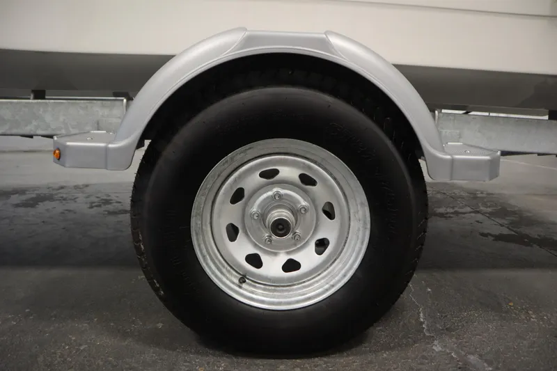 Slide: The Image of Trailer wheel of 2026 Bayliner Trophy T18 boat, close-up view. - 42