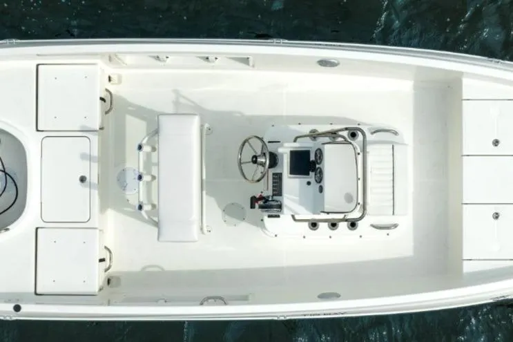 Slide: The Image of 2026 Bayliner T18 LE boat, top view, showcasing spacious deck and modern controls. - 45