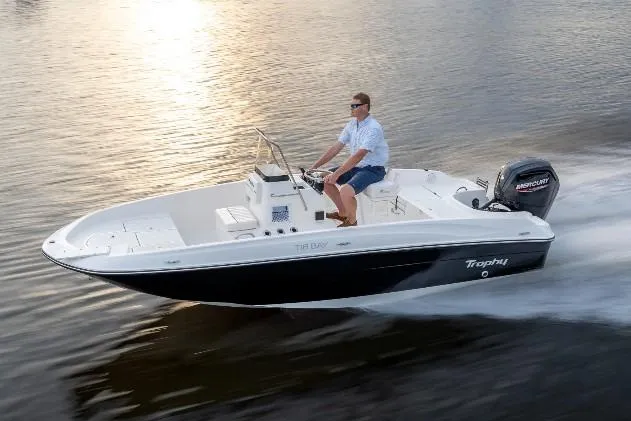 Slide: The Image of 2026 Bayliner T18 LE boat cruising on water at sunset. - 46