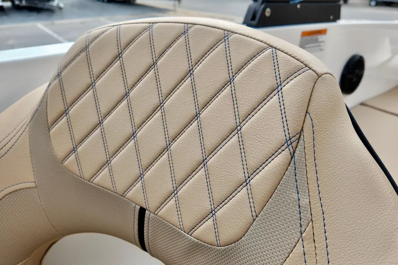 Slide: The Image of 2026 Bayliner VR6 boat seat with diamond-stitched beige upholstery. - 14
