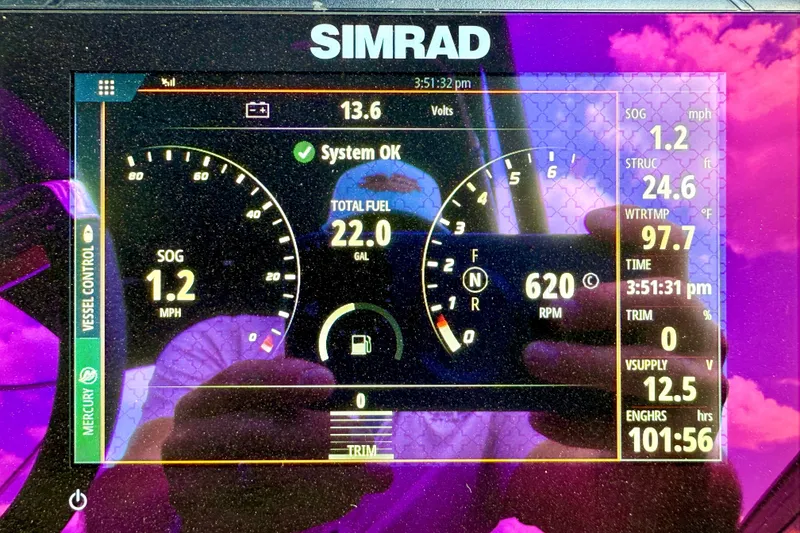 Slide: The Image of Simrad display on 2021 Barletta L25UC showing speed, fuel, and engine data. - 14