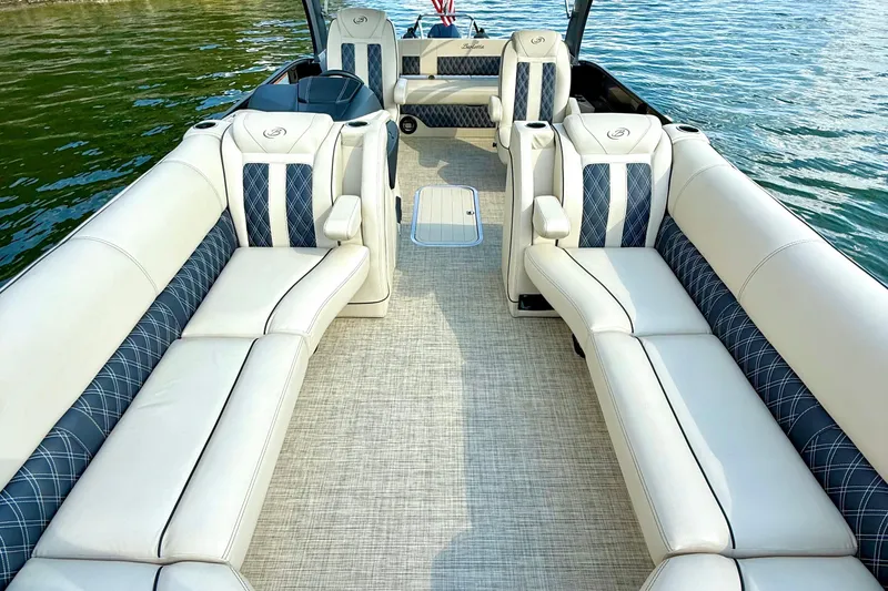 Slide: The Image of 2021 Barletta L25UC pontoon boat interior with luxurious seating on the water. - 38