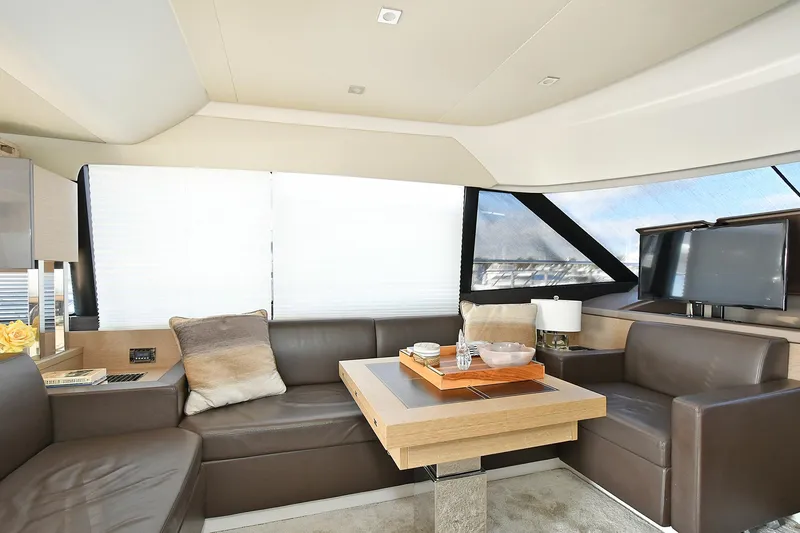 Slide: The Image of Luxurious interior of 2018 Prestige 560 Fly yacht with modern seating and elegant decor. - 23