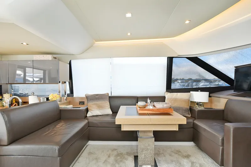 Slide: The Image of Luxurious interior of 2018 Prestige 560 Fly yacht with modern seating and elegant decor. - 24