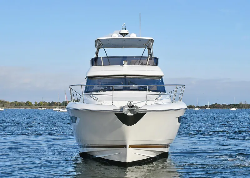 Slide: The Image of 2018 Prestige 560 Fly yacht on calm water, front view. - 3