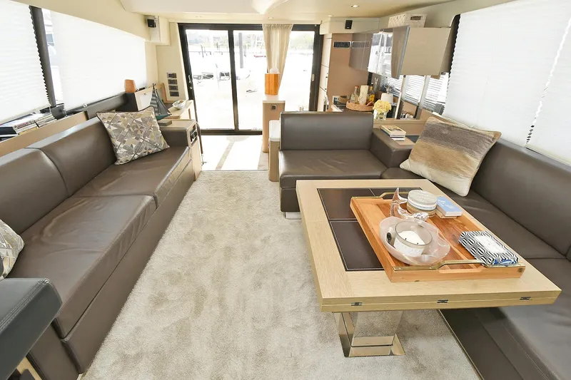 Slide: The Image of Luxurious interior of 2018 Prestige 560 Fly yacht with elegant seating and dining area. - 30