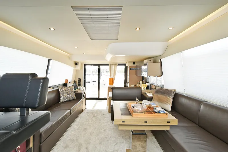 Slide: The Image of Luxurious interior of 2018 Prestige 560 Fly yacht with modern seating and elegant decor. - 31