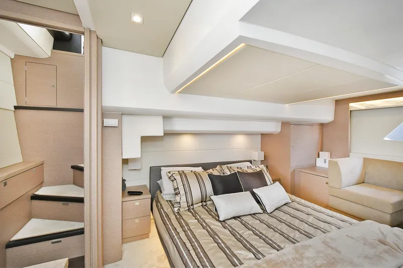 Slide: The Image of Luxurious bedroom interior of 2018 Prestige 560 Fly yacht with modern design and cozy bedding. - 42