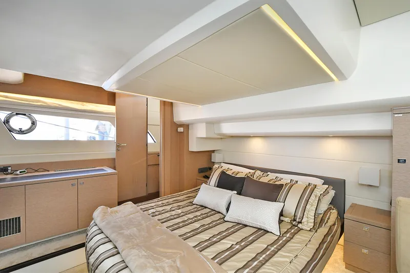 Slide: The Image of Luxurious bedroom interior of 2018 Prestige 560 Fly yacht with modern design and cozy bedding. - 43