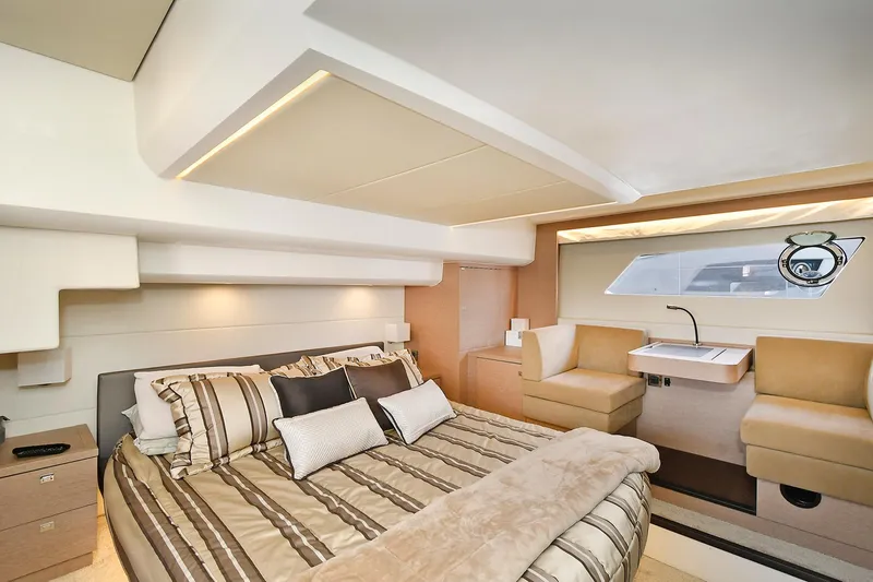 Slide: The Image of Luxurious interior of 2018 Prestige 560 Fly yacht with elegant bedroom and seating area. - 46
