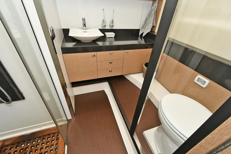 Slide: The Image of Luxurious bathroom on 2018 Prestige 560 Fly yacht with modern fixtures and elegant design. - 48