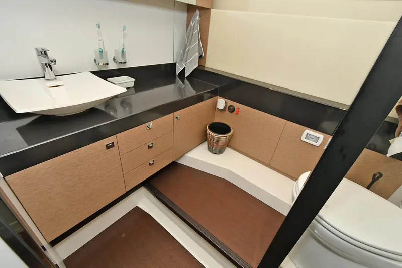 Slide: The Image of Luxurious bathroom in 2018 Prestige 560 Fly yacht with modern fixtures and elegant design. - 49