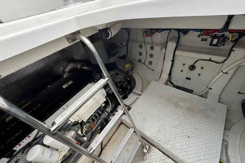 Slide: The Image of Engine room of 2019 Cruisers Yachts 42 Cantius with visible components and ladder. - 16