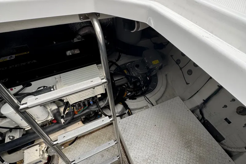 Slide: The Image of Engine compartment of 2019 Cruisers Yachts 42 Cantius with visible ladder and machinery. - 17