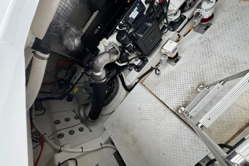 Slide: The Image of Engine room of 2019 Cruisers Yachts 42 Cantius, showcasing mechanical components and equipment. - 21