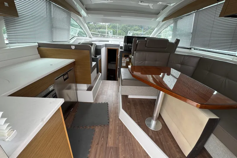 Slide: The Image of Interior of 2019 Cruisers Yachts 42 Cantius with modern seating and dining area. - 25