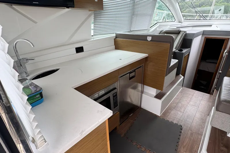 Slide: The Image of 2019 Cruisers Yachts 42 Cantius interior with modern kitchen and seating area. - 26
