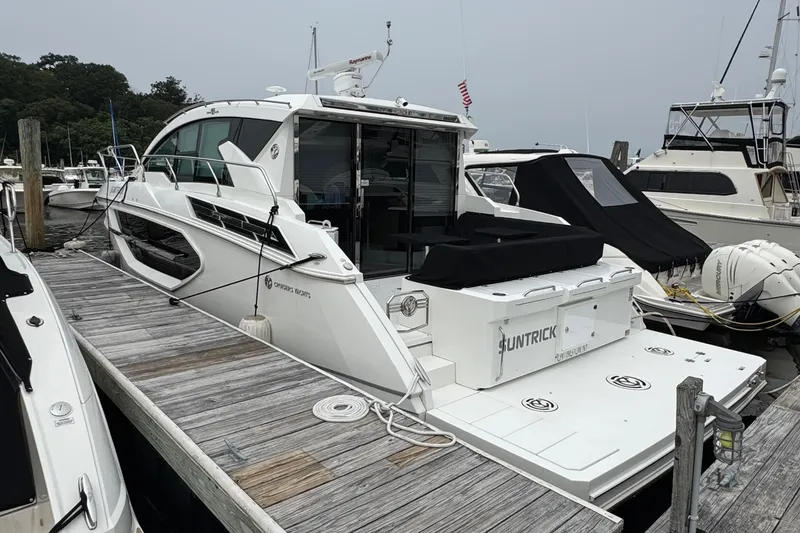Slide: The Image of 2019 Cruisers Yachts 42 Cantius docked at marina, sleek design, luxury features. - 3