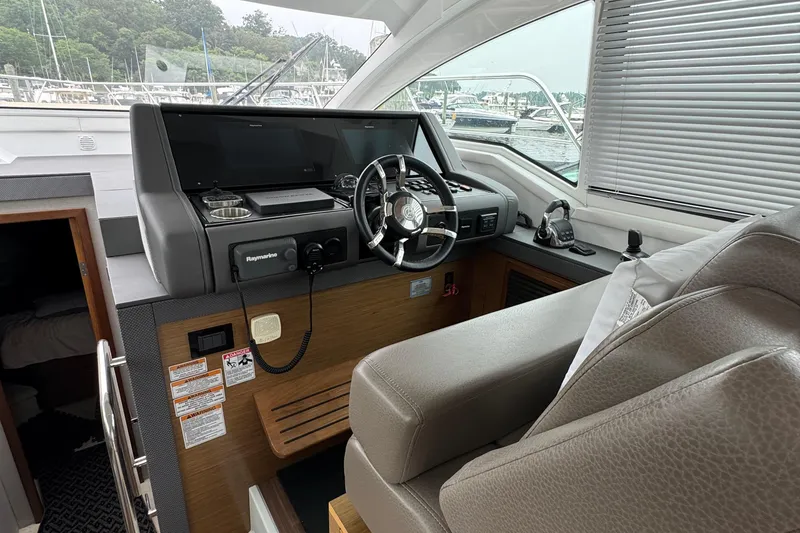 Slide: The Image of Interior helm of 2019 Cruisers Yachts 42 Cantius with modern controls and steering wheel. - 31