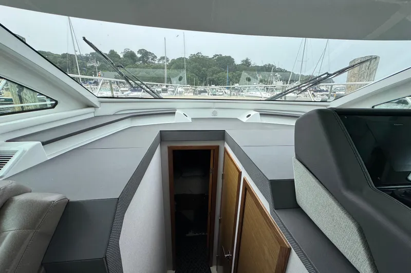 Slide: The Image of Interior view of 2019 Cruisers Yachts 42 Cantius, showcasing helm and cabin entrance. - 39