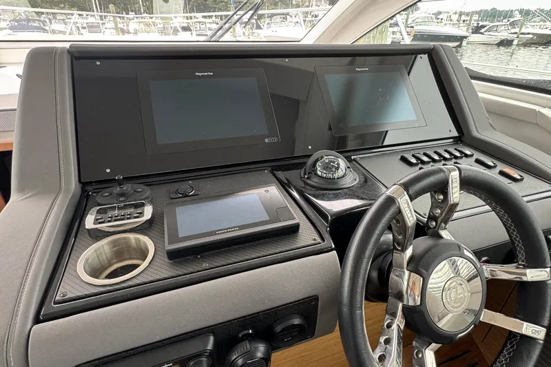 Slide: The Image of Helm of 2019 Cruisers Yachts 42 Cantius with navigation screens and controls. - 43