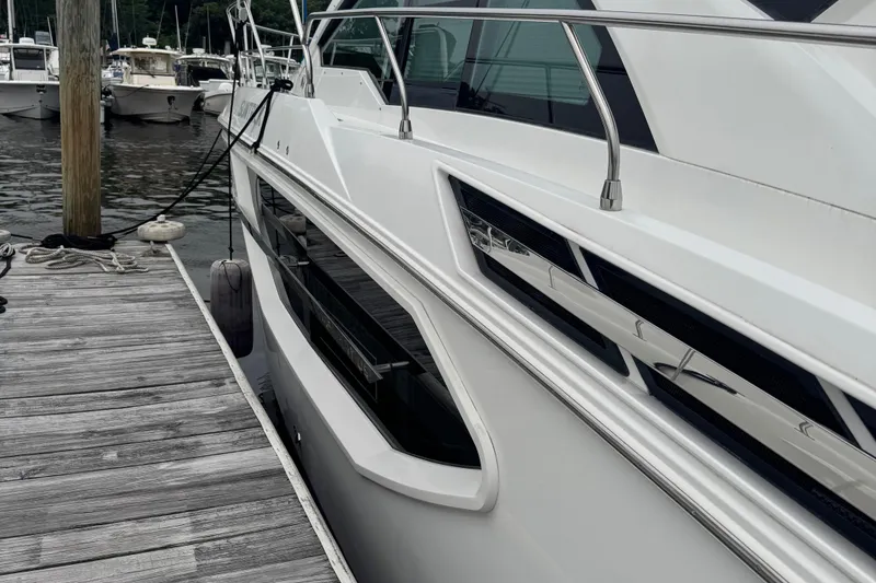 Slide: The Image of 2019 Cruisers Yachts 42 Cantius docked at marina, side view. - 5