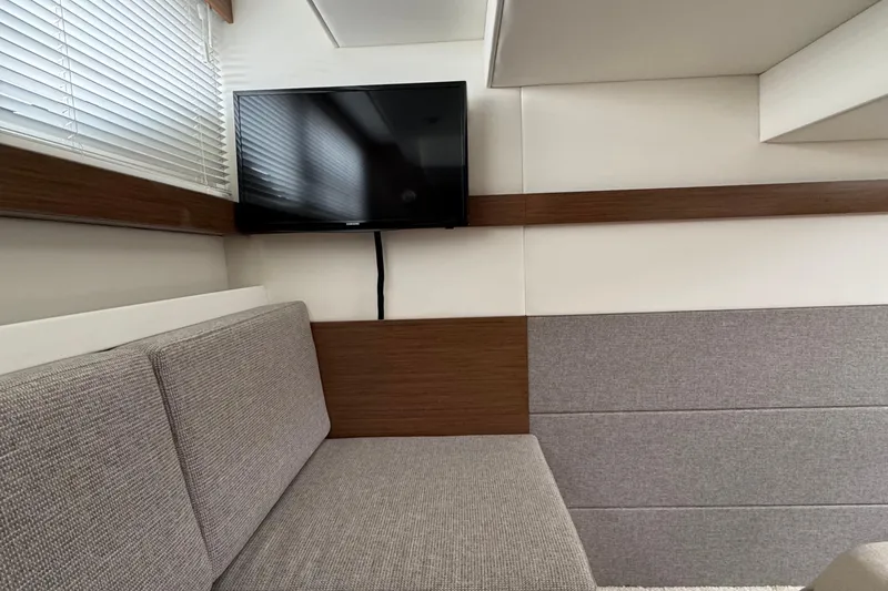 Slide: The Image of Interior of 2019 Cruisers Yachts 42 Cantius with TV and modern seating. - 57