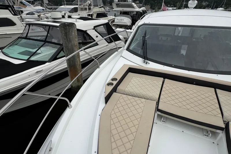 Slide: The Image of 2019 Cruisers Yachts 42 Cantius docked with luxurious seating and sleek design. - 9
