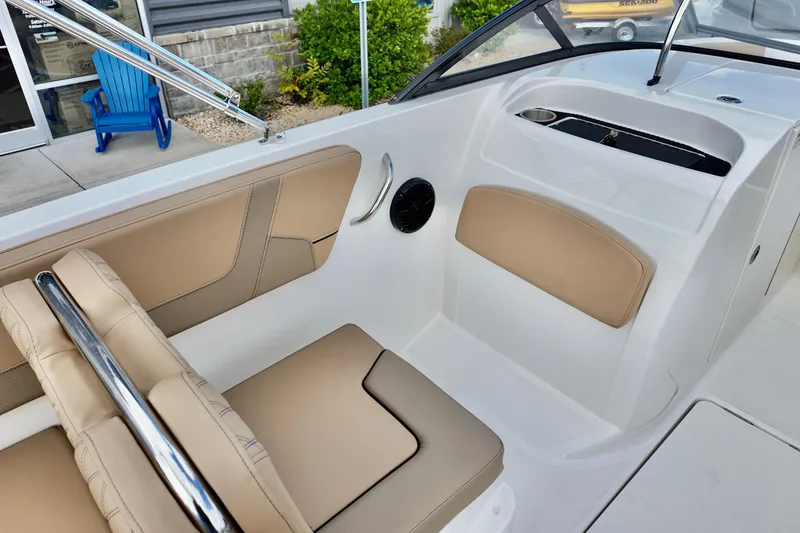 Slide: The Image of 2026 Bayliner VR6 boat interior with beige seating and modern design. - 16